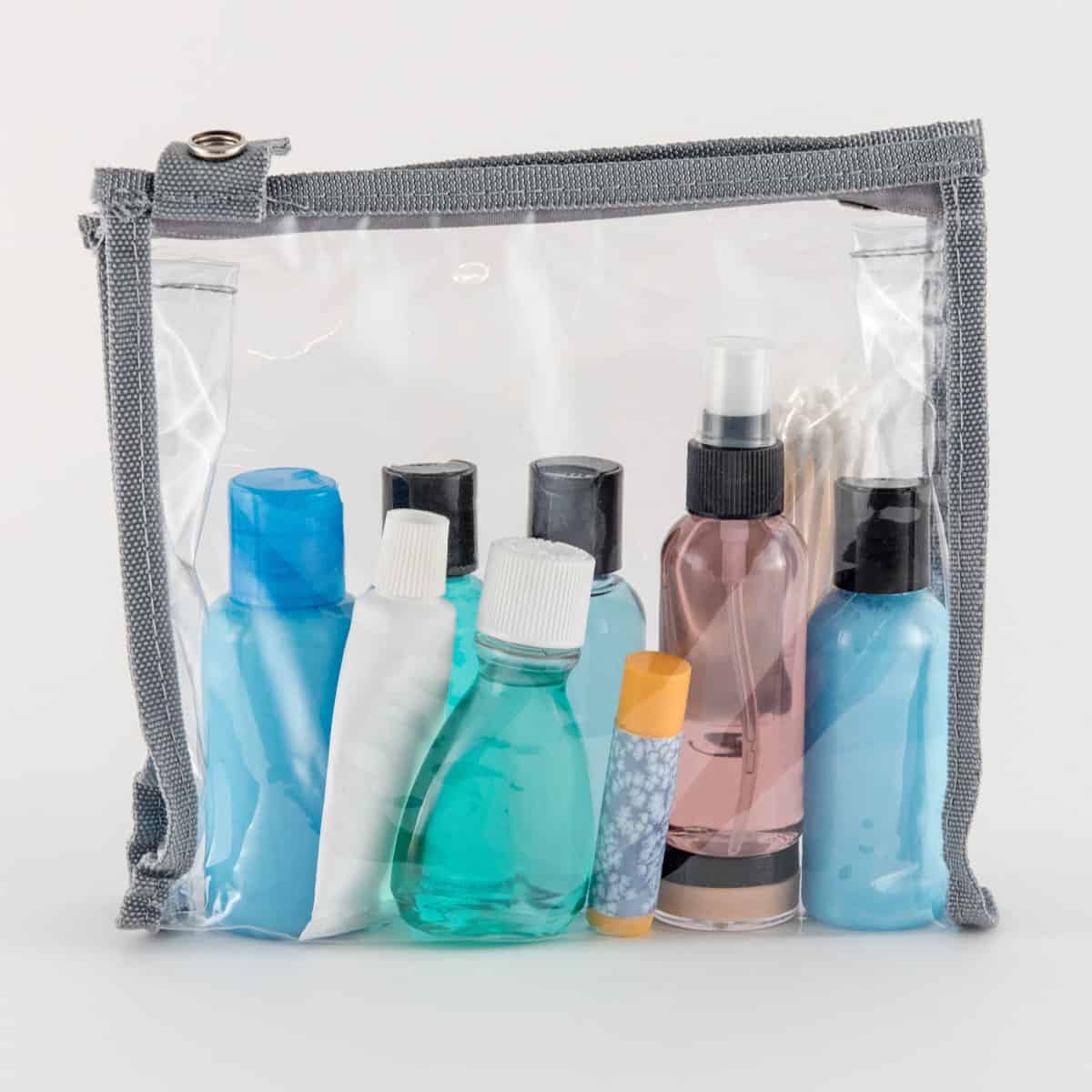 A small bag filled with cosmetic products on a white background