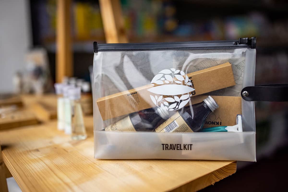 A transparent travel kit on a table
