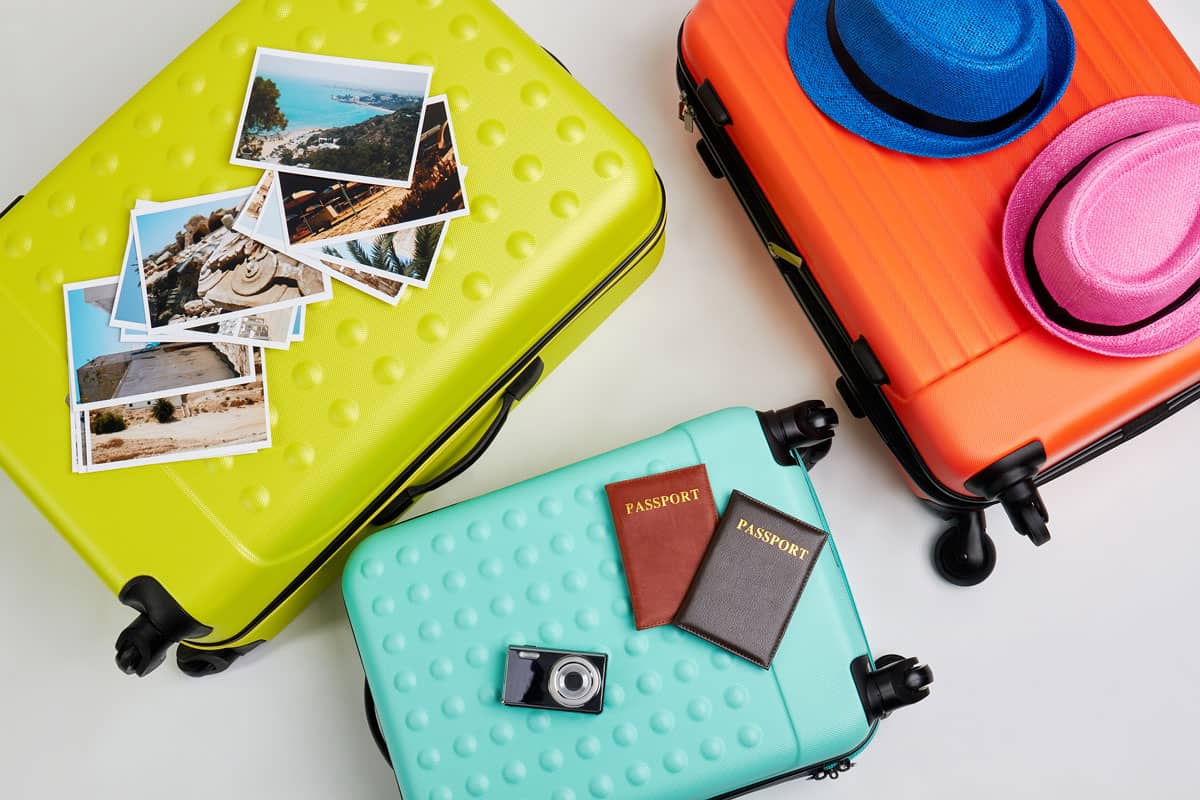 Colorful suitcases for family trip, Luggage and different accessories