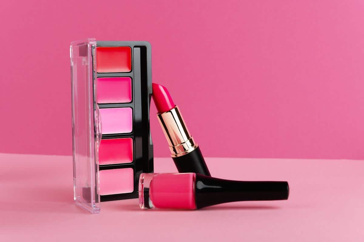 Lip gloss, blusher palette and lipstick