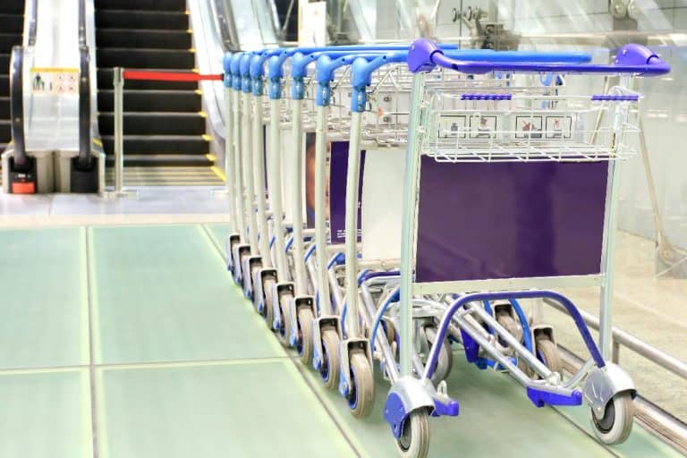 Row of luggage carts at modern airport, How To Get A Luggage Cart At The Airport
