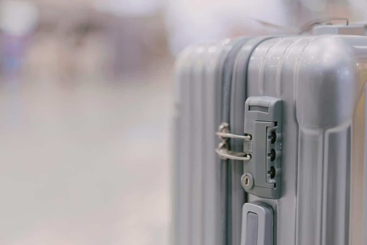 Safety locks luggage tag label on suitcase