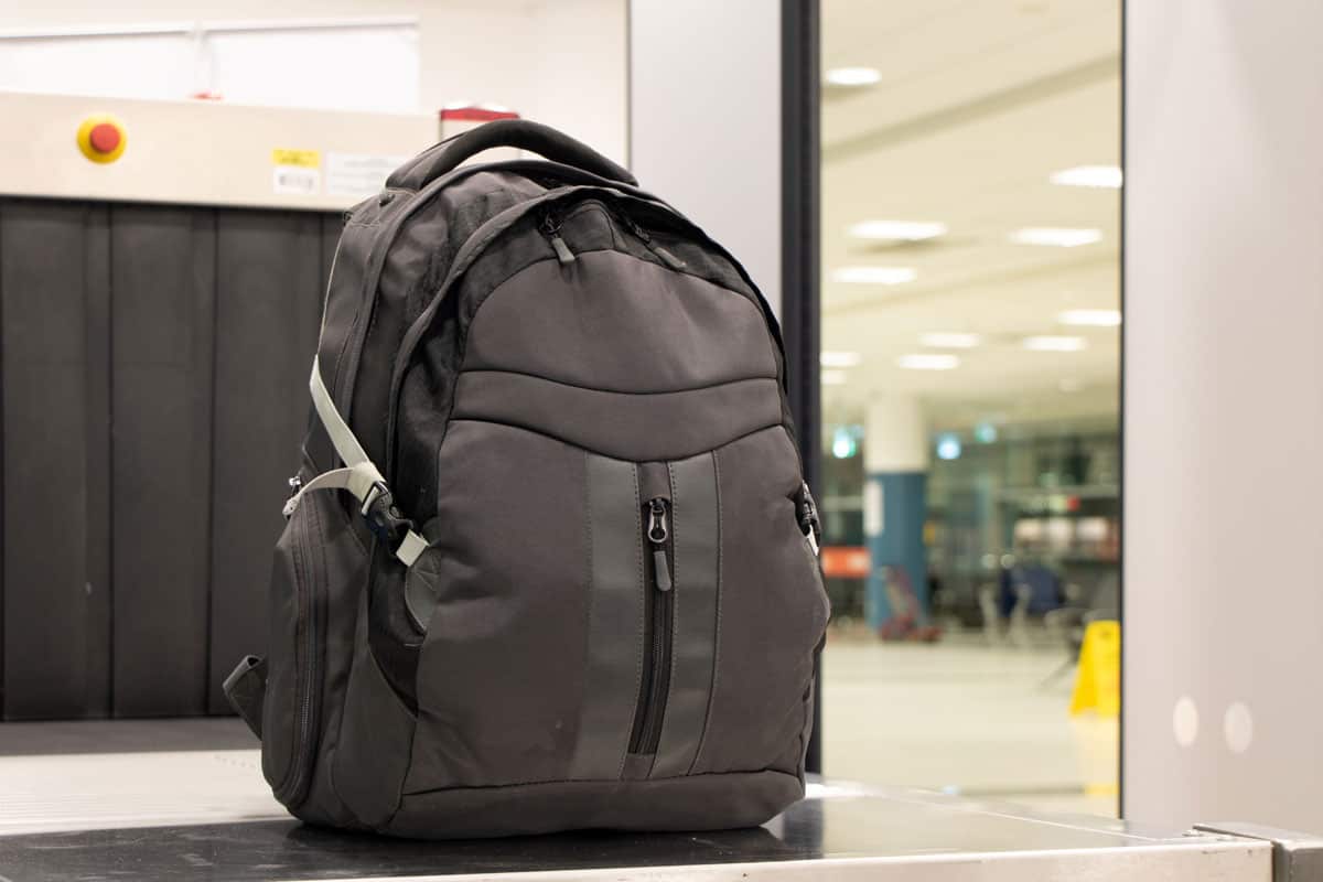 black backpack, inspection, hand carry, airport terminal
