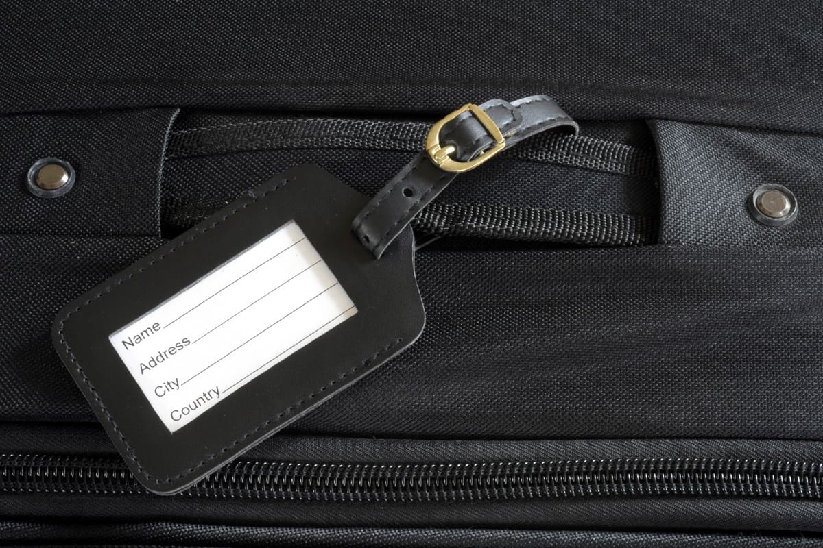 black leather label on a black suitcase