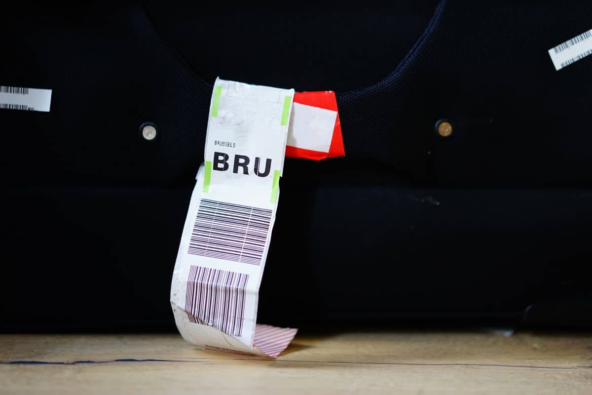 Baggage tag with BRU code for Brussels, Belgium. Selective focus on baggage tag.