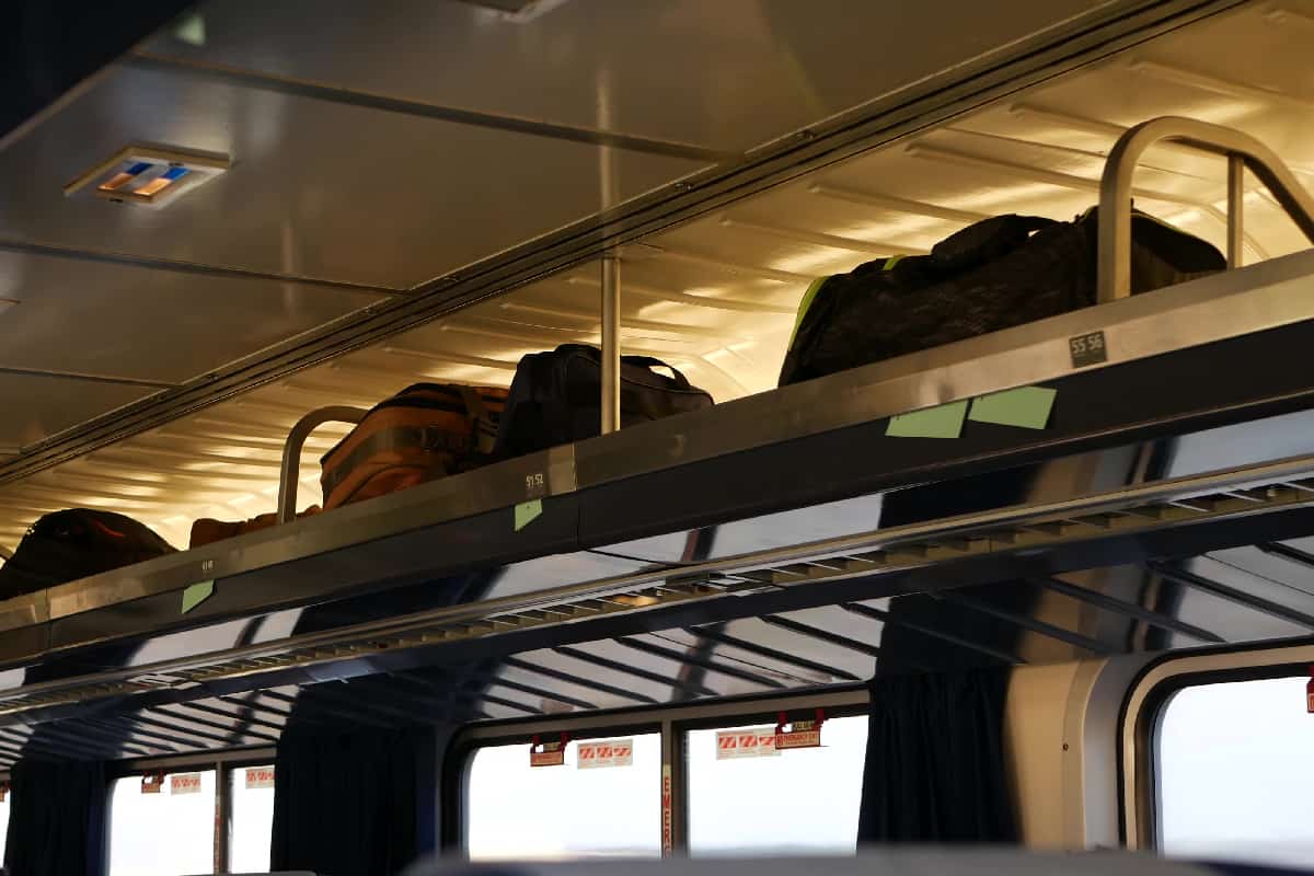 Carry on bags on over head train compartment