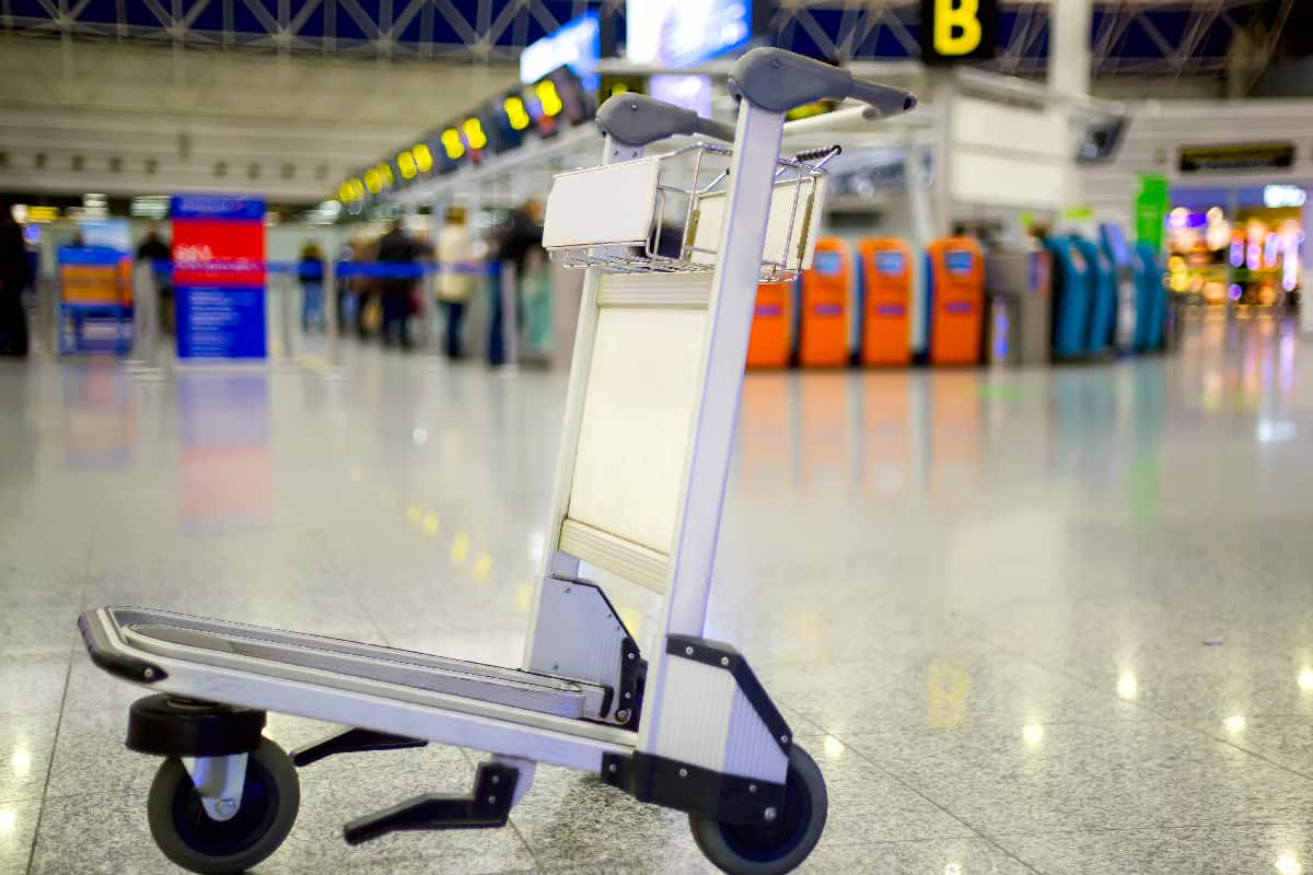Empty metal cart for luggage standing at airport