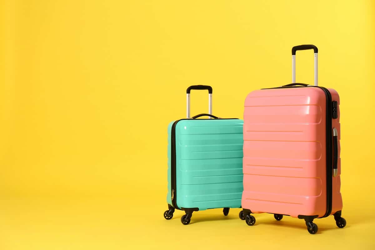 Is There An Alternative To The Away Bigger Carry-On - Stylish suitcases on color background.