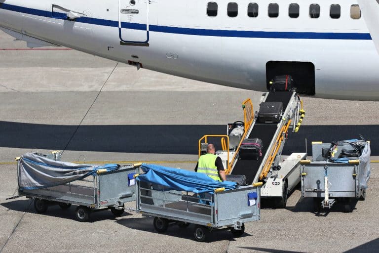A luggage being loaded into narrow body aircraft, Are Luggage Carts Allowed On Airplanes?