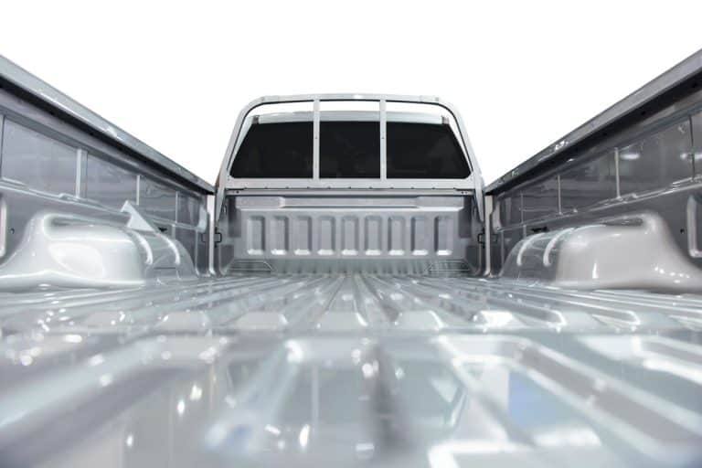 close up photo of rear pick up truck bed, grey painted pick up truck, Will Suitcase Fly Out Of Truck Bed?