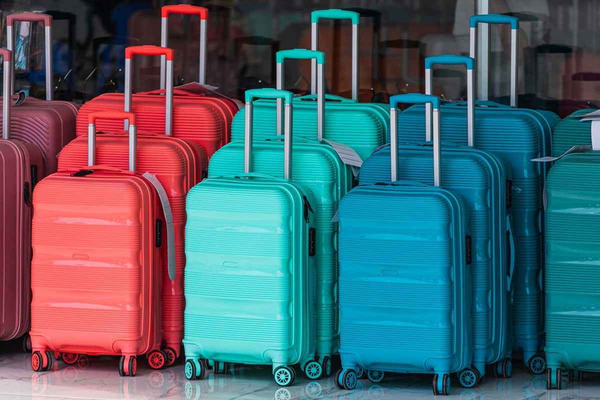 photo of a colorful family bundle hardside luggage suitcase on the display of the luggage store of mall