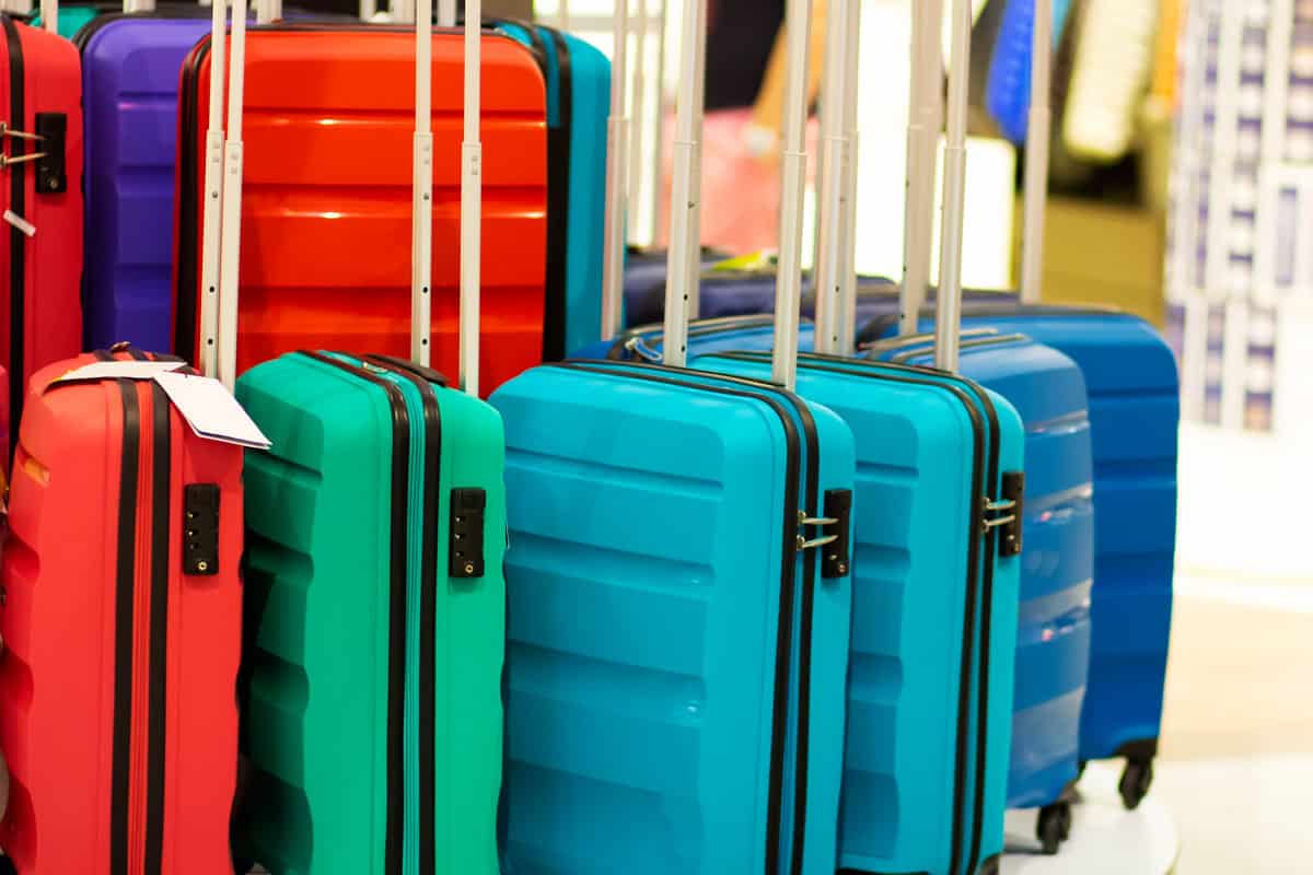 photo of a colorful hardside luggage on the display of the mall for sale luggage