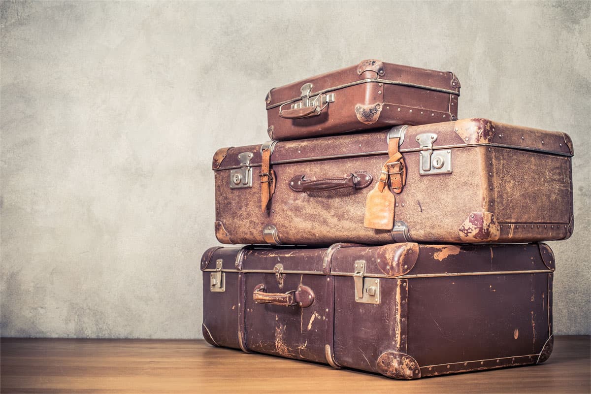 photo of a leather suitcase on top of each other, brown leather suitcase, three suitcase