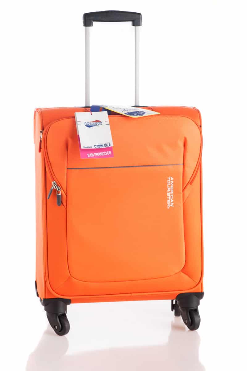 portrait photo of an orange american tourister suitcase with white background