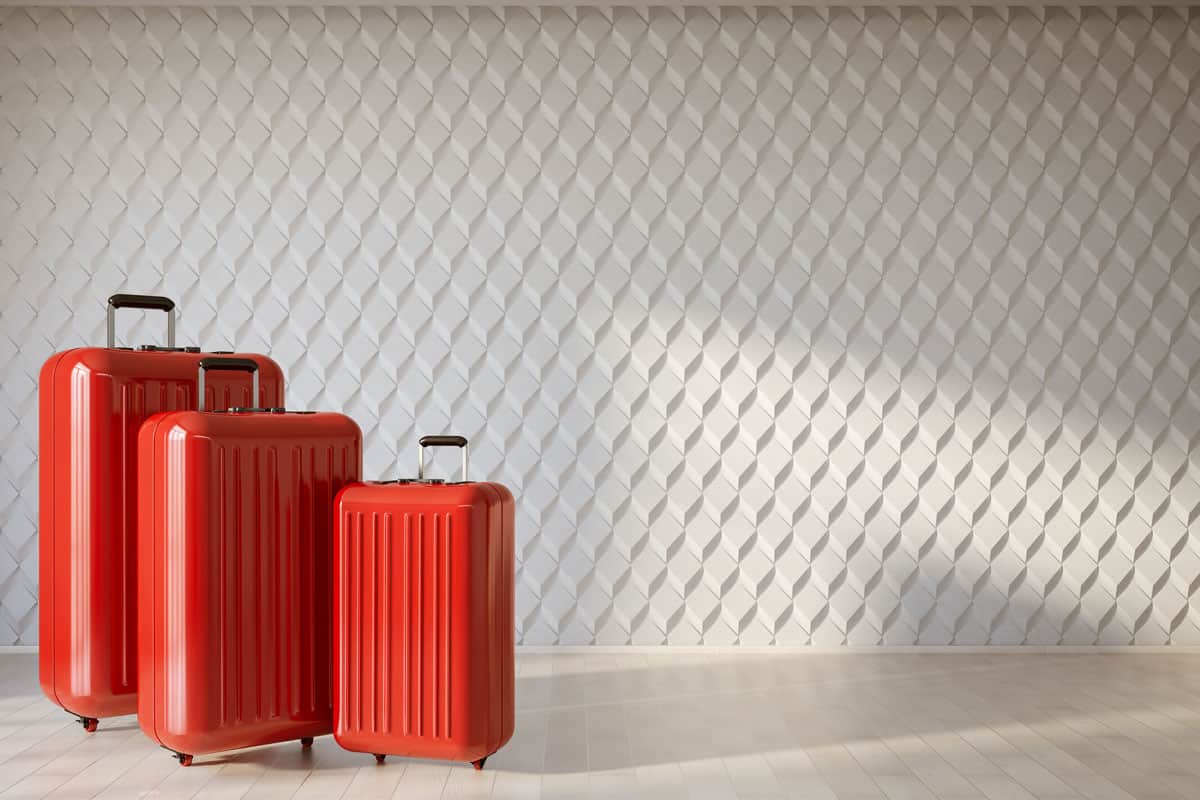 three red luggage on the photo with white background on the back