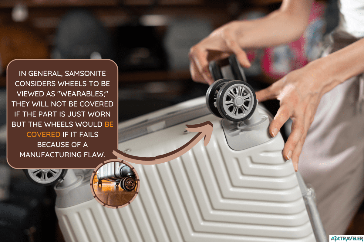 A female shopper chooses a plastic suitcase in a store. checks the rollers on the travel suitcase - Does Samsonite Warranty Cover Wheels
