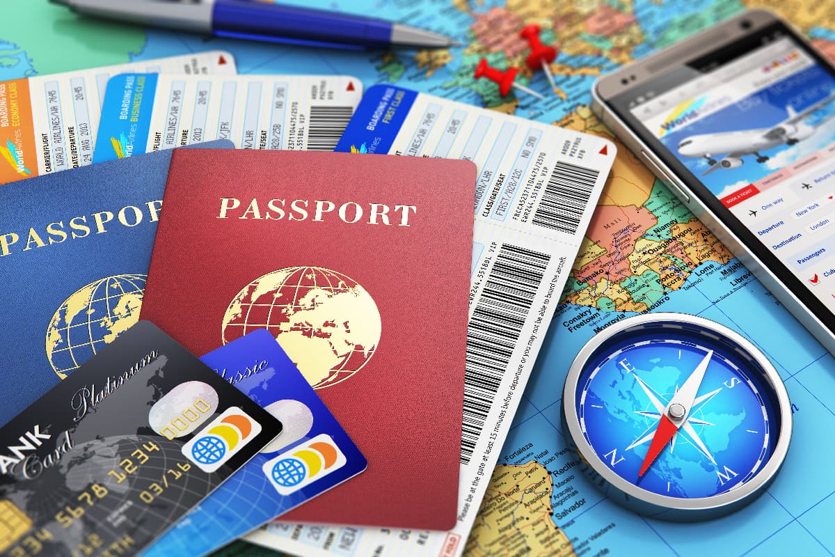 Boarding pass, passports, smartphone with online airline tickets booking