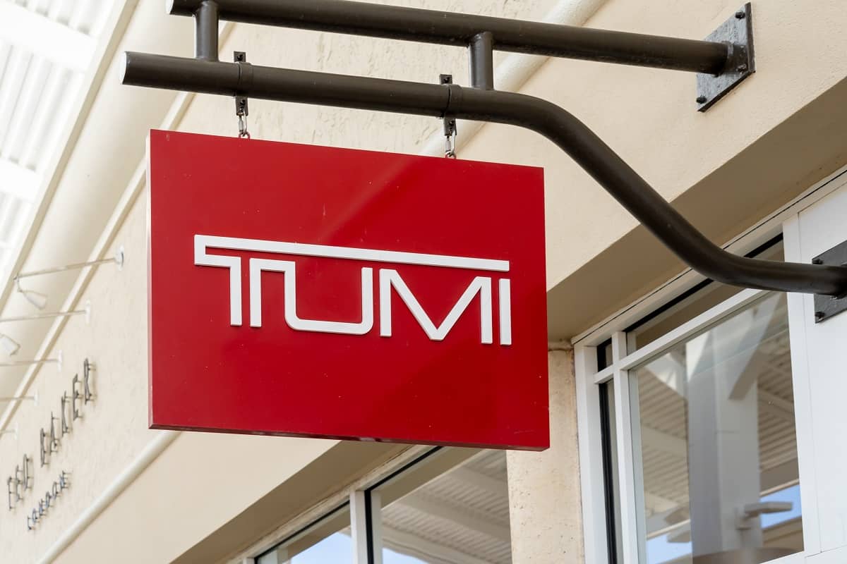Does TUMI Monogram In-Store? - Close up of Tumi store hanging sign is shown