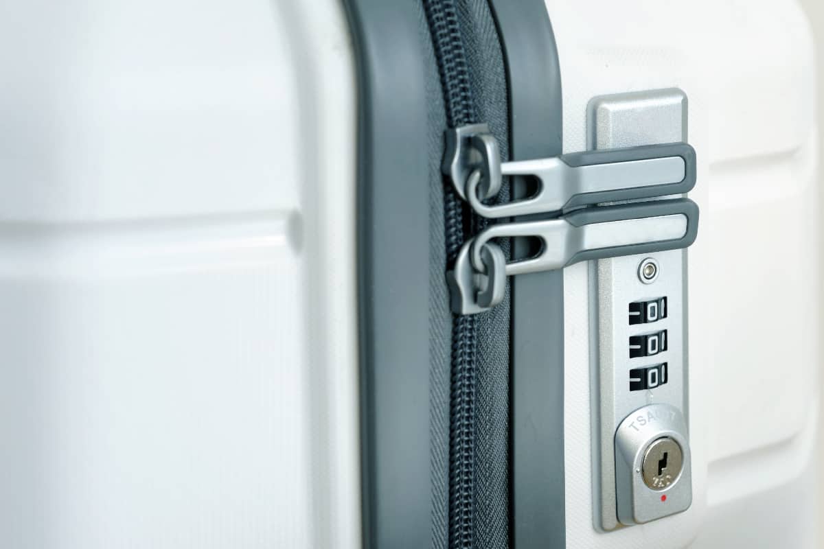 Closeup detail of a suitcase with focus on the lock password number