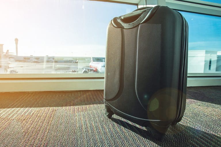 Luggage over airport background, What is smart luggage?
