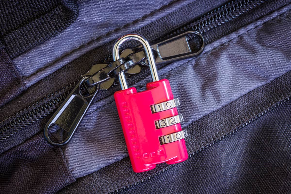 Red combination padlock on luggage