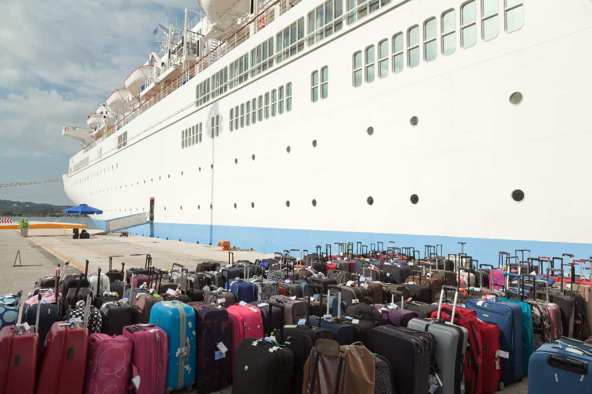 Suitcases and cruise ship at pier