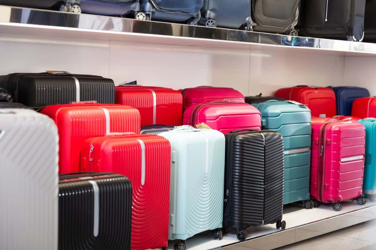 Suitcases in a dry goods store. Shelving luggage.

