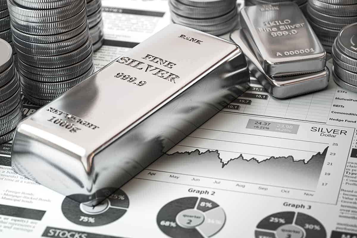 Silver bar, ingots and coins on financial report