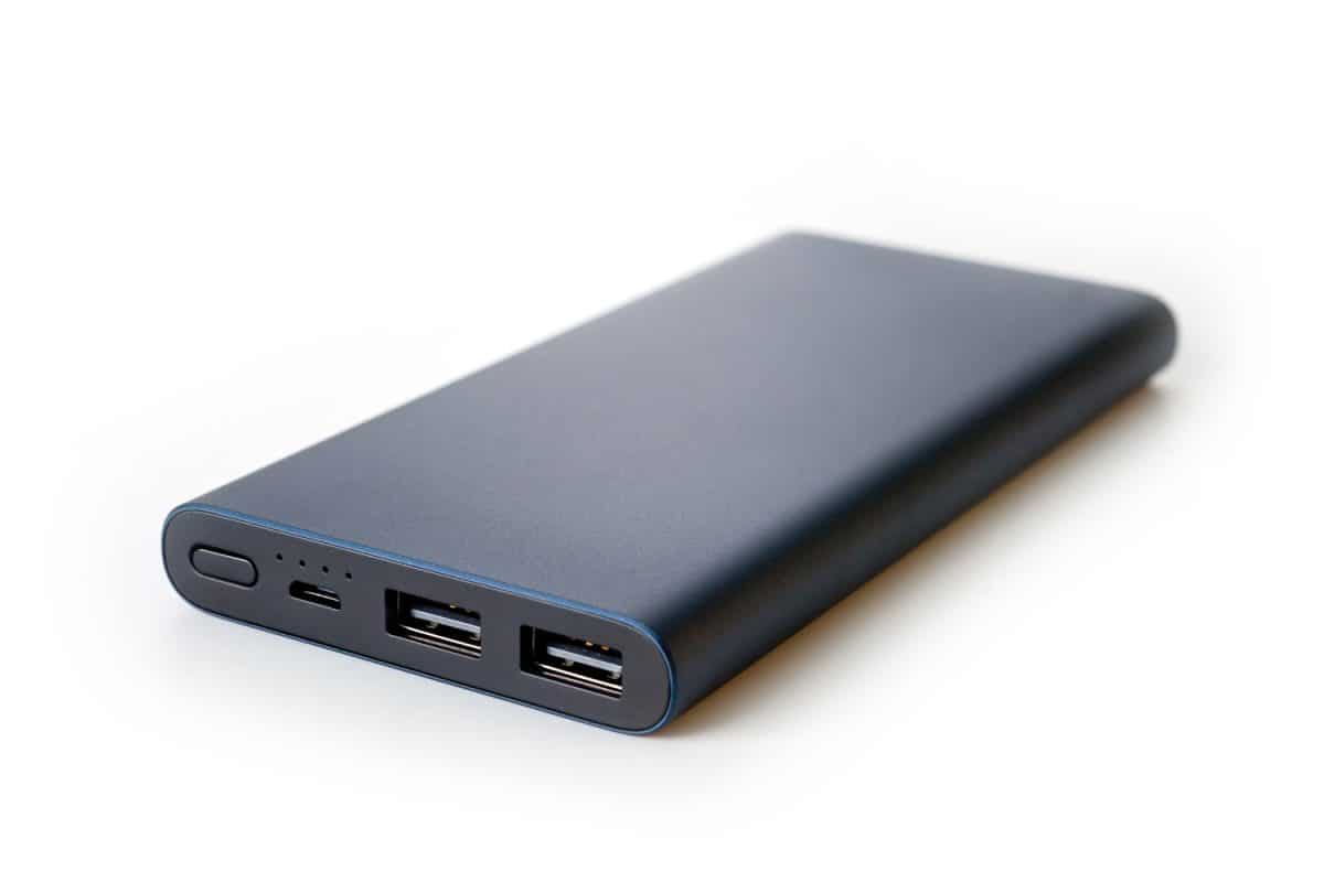 Powerbank new, powerful dark color with two usb inputs on a white background
